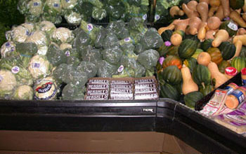 Finish Your Broccoli written on the Hershey bars themselves, placed near broccoli in the grocery store.